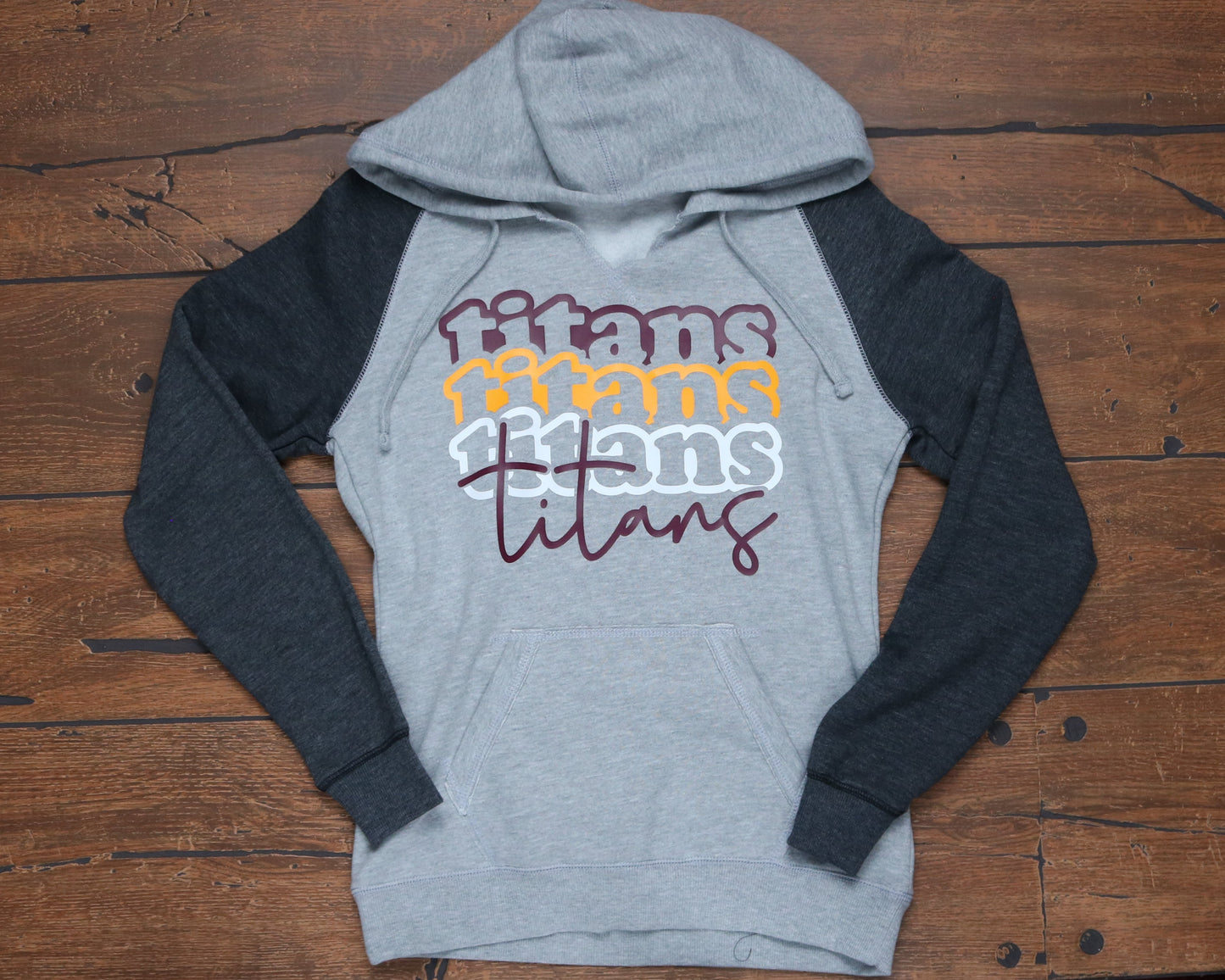 Two-toned v-neck hoodie with stacked Titans Ladies cut
